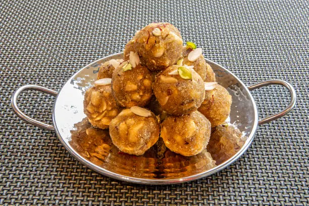 Indian Food Gond ke laddoo, sweet Dink laddu also known as Dinkache ladoo is made using edible gum with dry fruits is made and enjoyed especially northern part of India in winter season