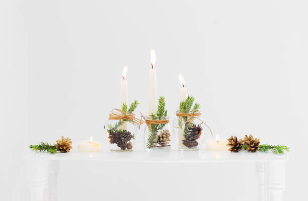 istock home christmas decor with burning candles in whte interior 1344575944