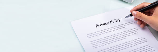 istock Woman Holding Pen Over Privacy Policy Form 1344576897