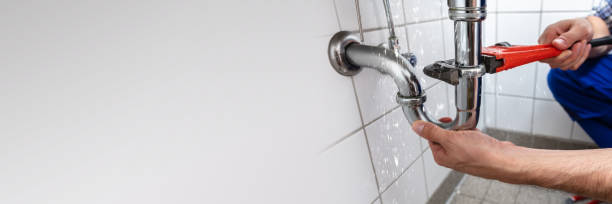 Plumber Repairing Sink Pipe Leakage