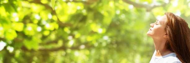 istock Young Woman Breathing Fresh Air 1344576928