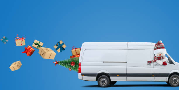 istock Delivery van driven by a snowman carries christmas presents 1344576957