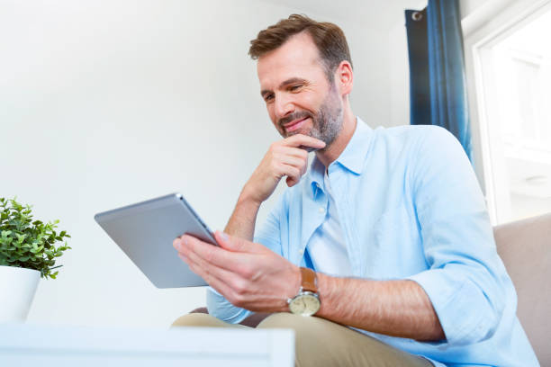 istock Handsome businessman working from home 1344577388