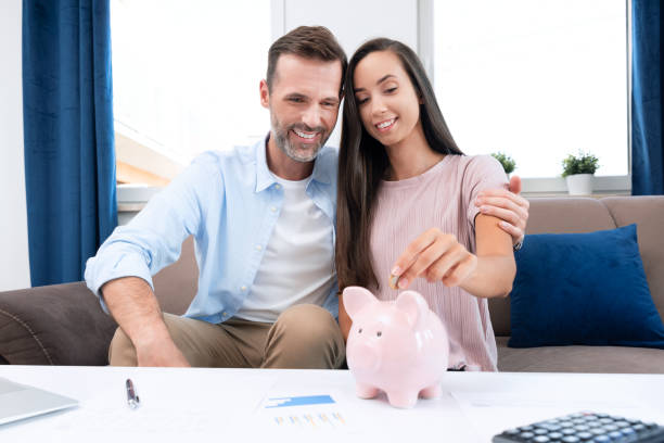 istock Young couple is saving money for their new home 1344577406