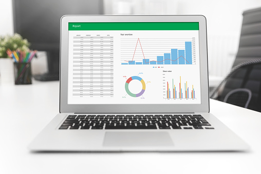 Laptop with charts, analyst works with data. Data analysis and statistics