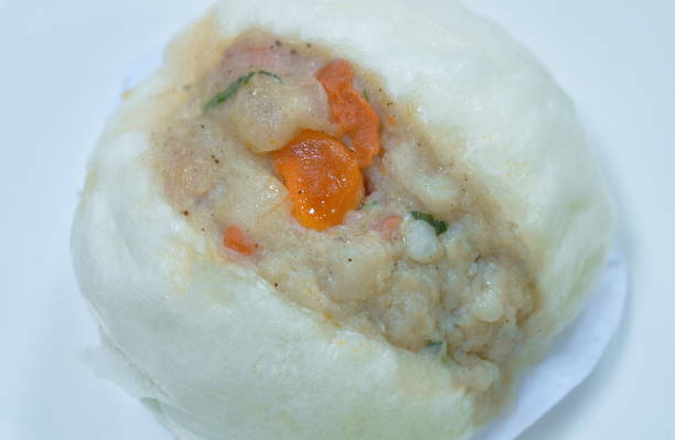 istock steamed bao Chinese bun stuffing mashed pork and salt egg 1344578110