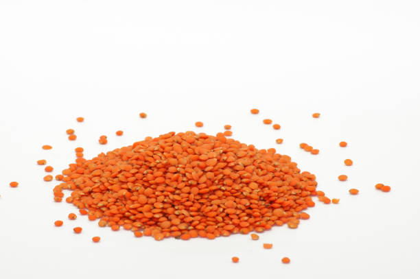 istock Uncooked red lentils exposed on white background 1344582230