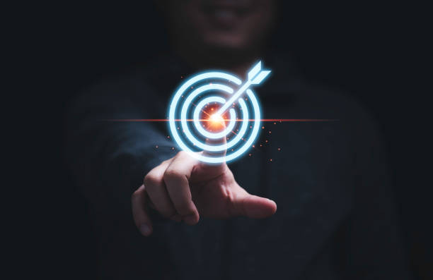 istock Businessman hand touching to target dart board for setup and achievement objectives target for business investment concept. 1344582497