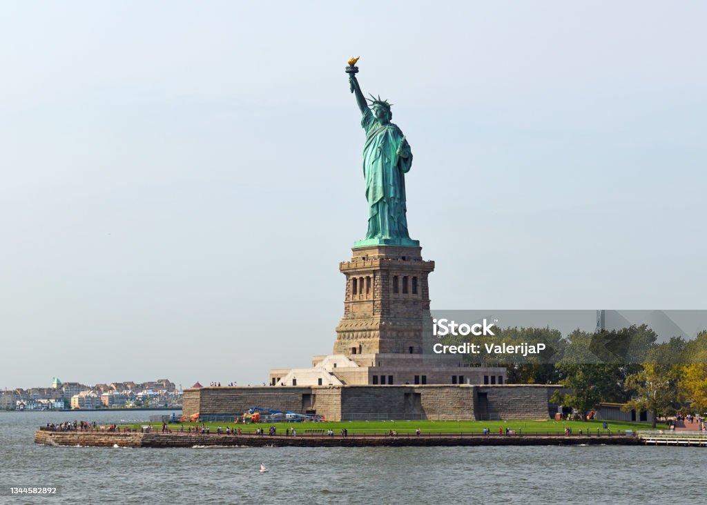 Famous Statue of Liberty, colossal neoclassical sculpture on Liberty Island in New York City, United States Famous Statue of Liberty, colossal neoclassical sculpture on Liberty Island in New York City, United States. Liberty Island Stock Photo