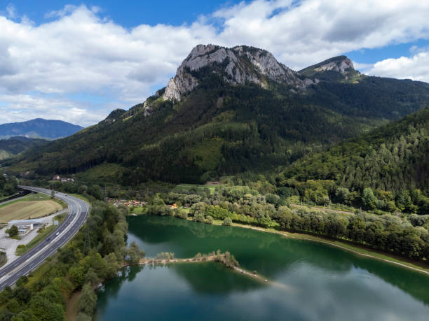 Röthelstein aerial view of bathing pond between freeway and mountain peak Roethelstein in Styria, Austria frohnleiten stock pictures, royalty-free photos & images