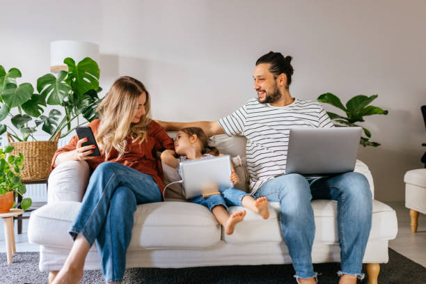 istock Family spend free time at home surfing internet 1344585072