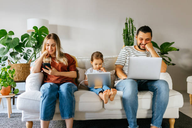 istock Family spend free time at home surfing internet 1344585106