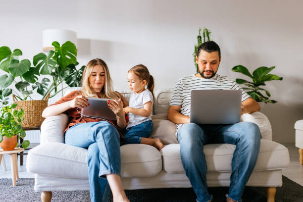 istock Family spend free time at home surfing internet 1344585151