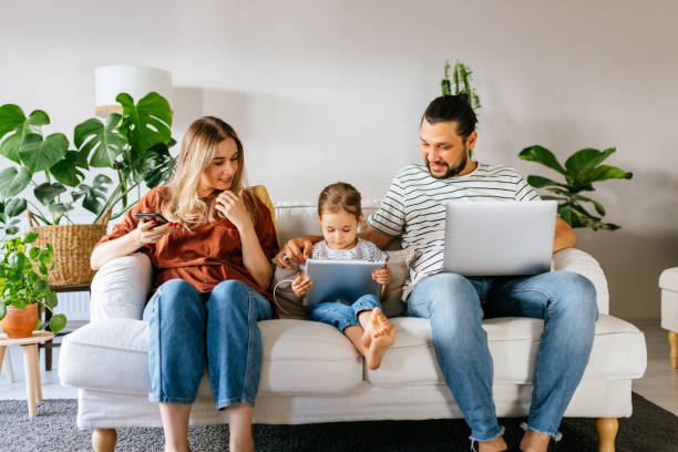 istock Family spend free time at home surfing internet 1344585203