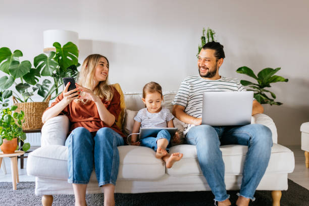 istock Family spend free time at home surfing internet 1344585253