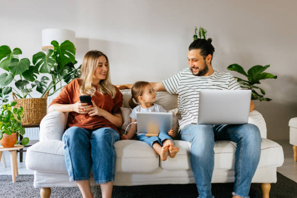 istock Family spend free time at home surfing internet 1344585297
