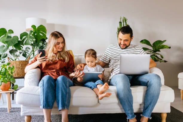 istock Family spend free time at home surfing internet 1344585880