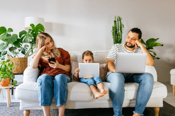 istock Family spend free time at home surfing internet 1344585960