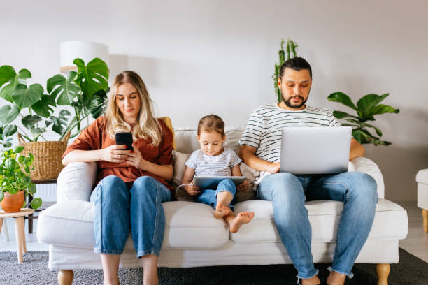 istock Family spend free time at home surfing internet 1344586131