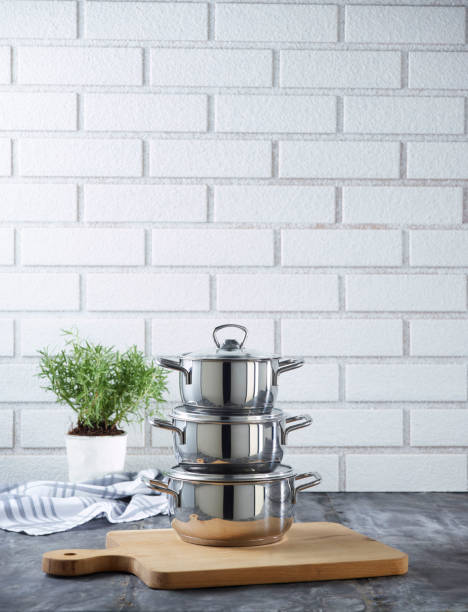 istock stainless steel pan set in front of brick wall 1344586246