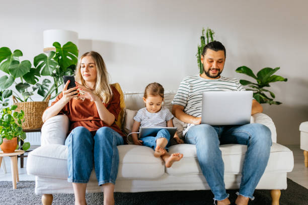 istock Family spend free time at home surfing internet 1344586304