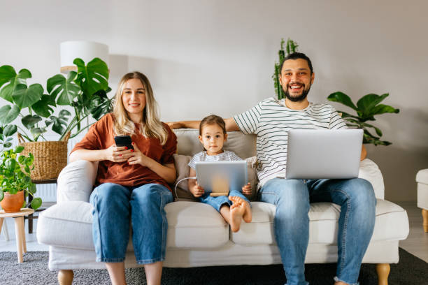 istock Family spend free time at home surfing internet 1344586340