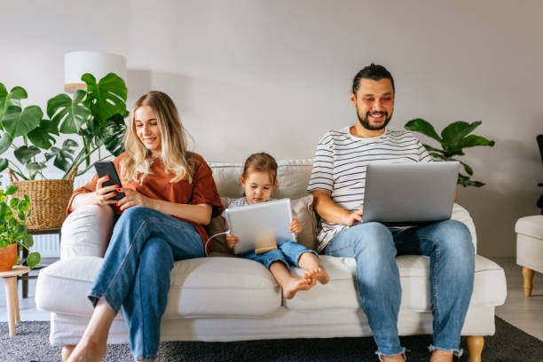 istock Family spend free time at home surfing internet 1344586442