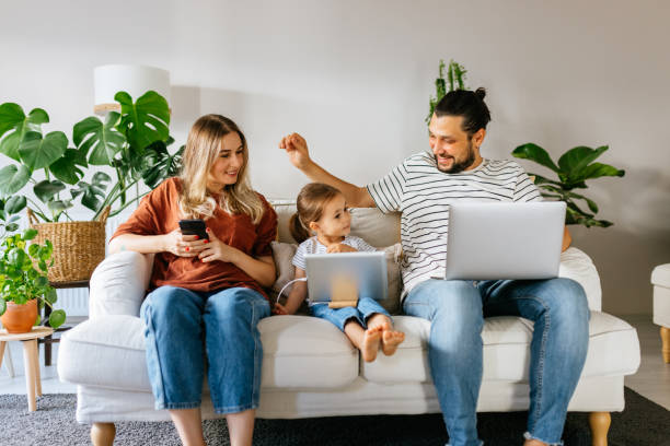 istock Family spend free time at home surfing internet 1344586533