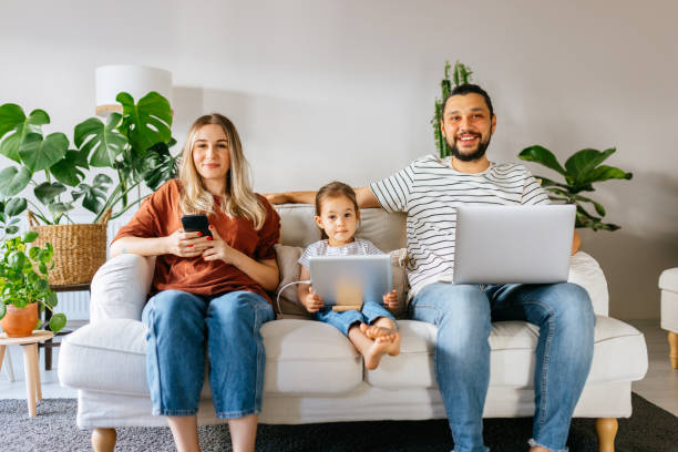 istock Family spend free time at home surfing internet 1344586582