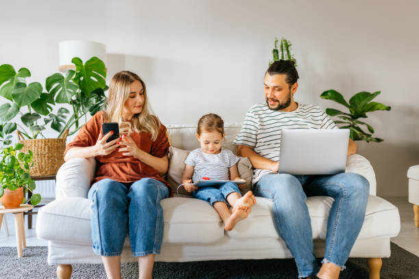 istock Family spend free time at home surfing internet 1344586751