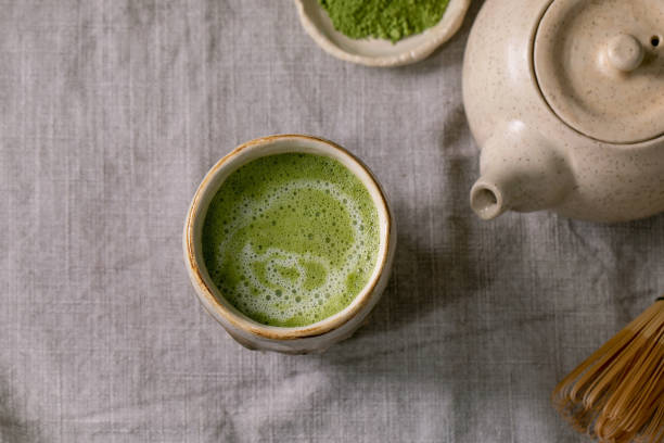 istock Traditional hot green tea matcha in ceramic cup 1344589802
