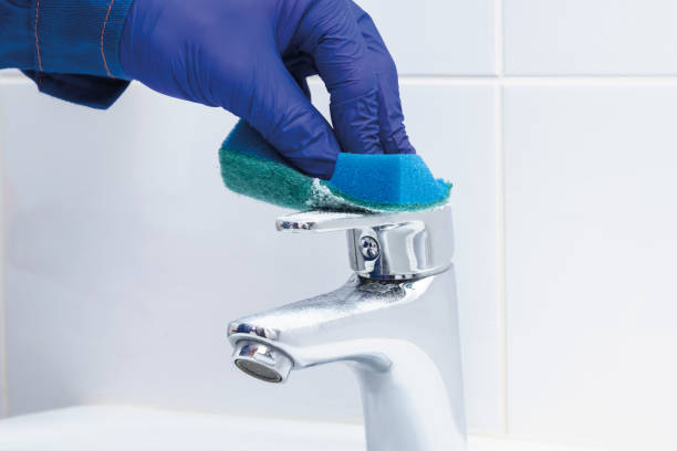istock a hand with a sponge restores chrome on a tap 1344594859