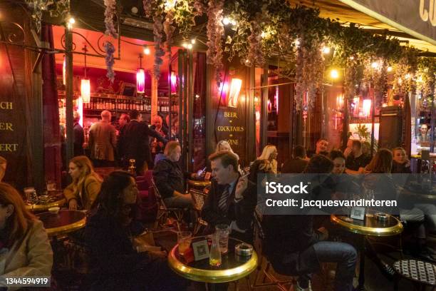 Terrace And Café Near The Arc De Triomphe In Paris In The Evening People Are Sitting On The Terrace Talking And Drinking Stock Photo - Download Image Now