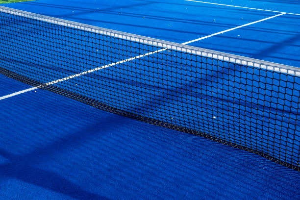 istock Net an lines on a blue paddle tennis court 1344595027