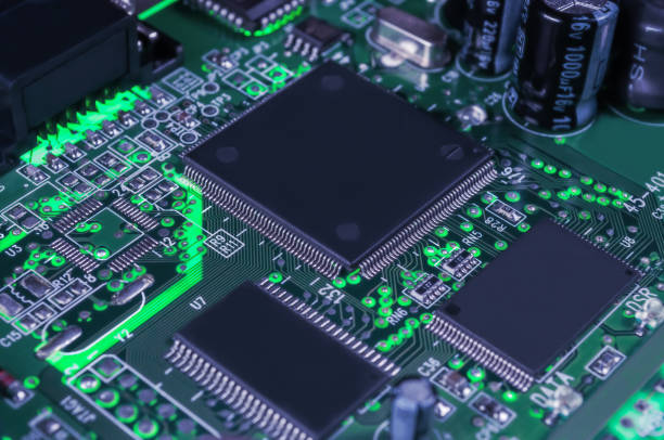 istock electronic circuit board with passive and active circuit components and IC close-up 1344595383