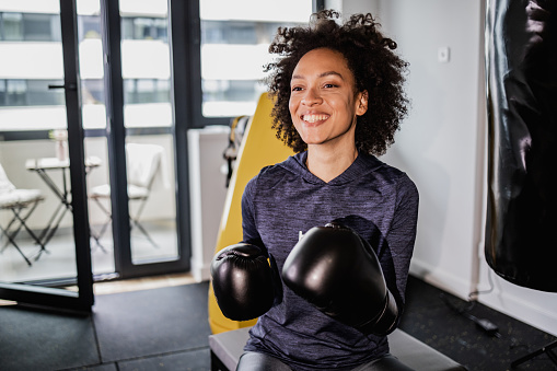 Portrait of a woman preparing for a box training