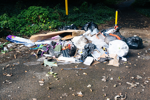 Heap of rubbish dumped illegaly by the roadside in England.