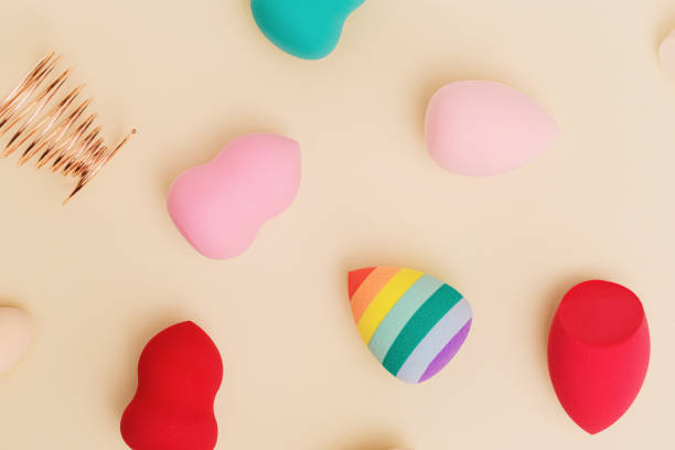 istock Flat lay colorful cosmetic beauty sponges close up different form. Makeup tool for applying products 1344598949