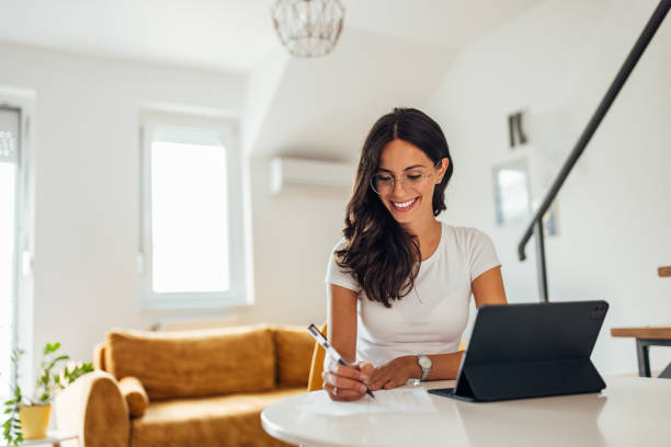 istock Adult woman, working hard from home. 1344600535