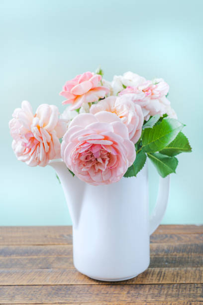 istock Beautiful rose flowers in modern vase 1344604979