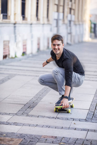istock A Young Man is Enjoying Vacation While Riding a Skateboard in the City and Exploring. 1344605189