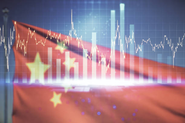 istock Multi exposure of virtual abstract financial graph interface on Chinese flag and sunset sky background, financial and trading concept 1344606035