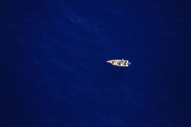 istock Boat sailing in Reunion island 1344606386
