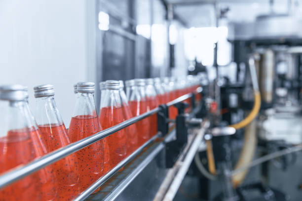 istock Closeup automation beverage bottled in drink factory automatic working process production line conveyor belt in Industry 4.0 standard. 1344607238