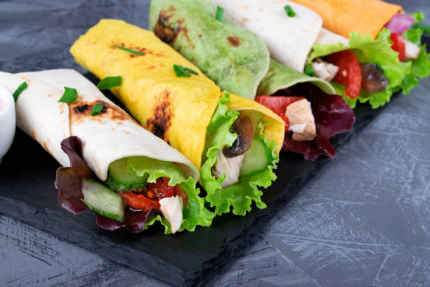 istock Assorted wraps with tortillas of various colors with chicken 1344607321