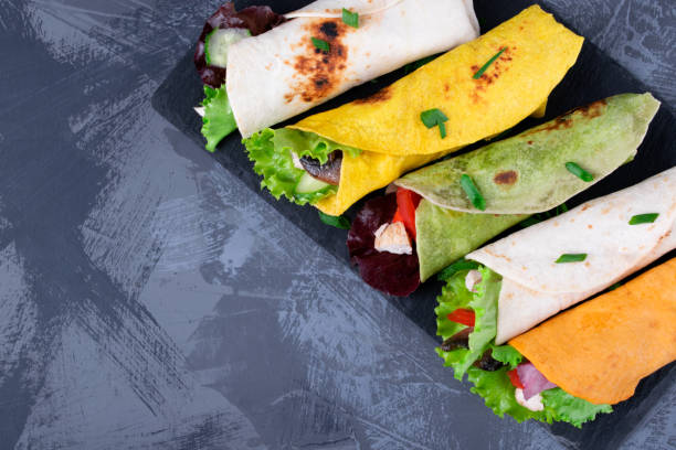 istock Assorted wraps with tortillas of various colors with chicken 1344607325