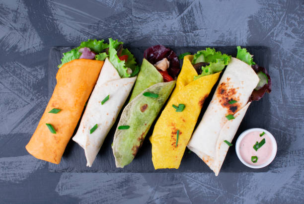 Assorted wraps with tortillas of various colors with chicken