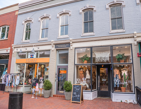 Boulder, CO - August 28, 2021: A clothing store with typical architecture on the Pearl Street Mall, a famous downtown area, with brick buildings and rustic, western style.