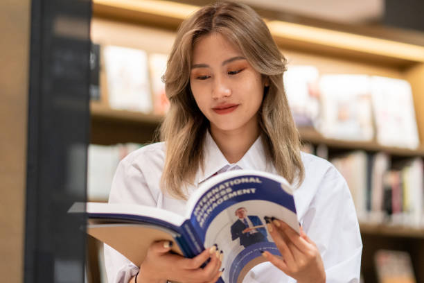 istock Young female student studying about business 1344609545