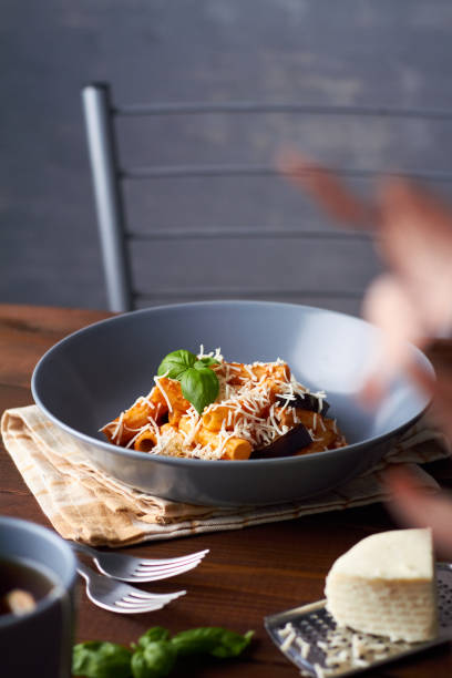 istock pasta alla norma with eggplant ricotta tomato sauce copy space 1344610511